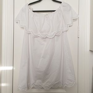 White lace detail off the should dress